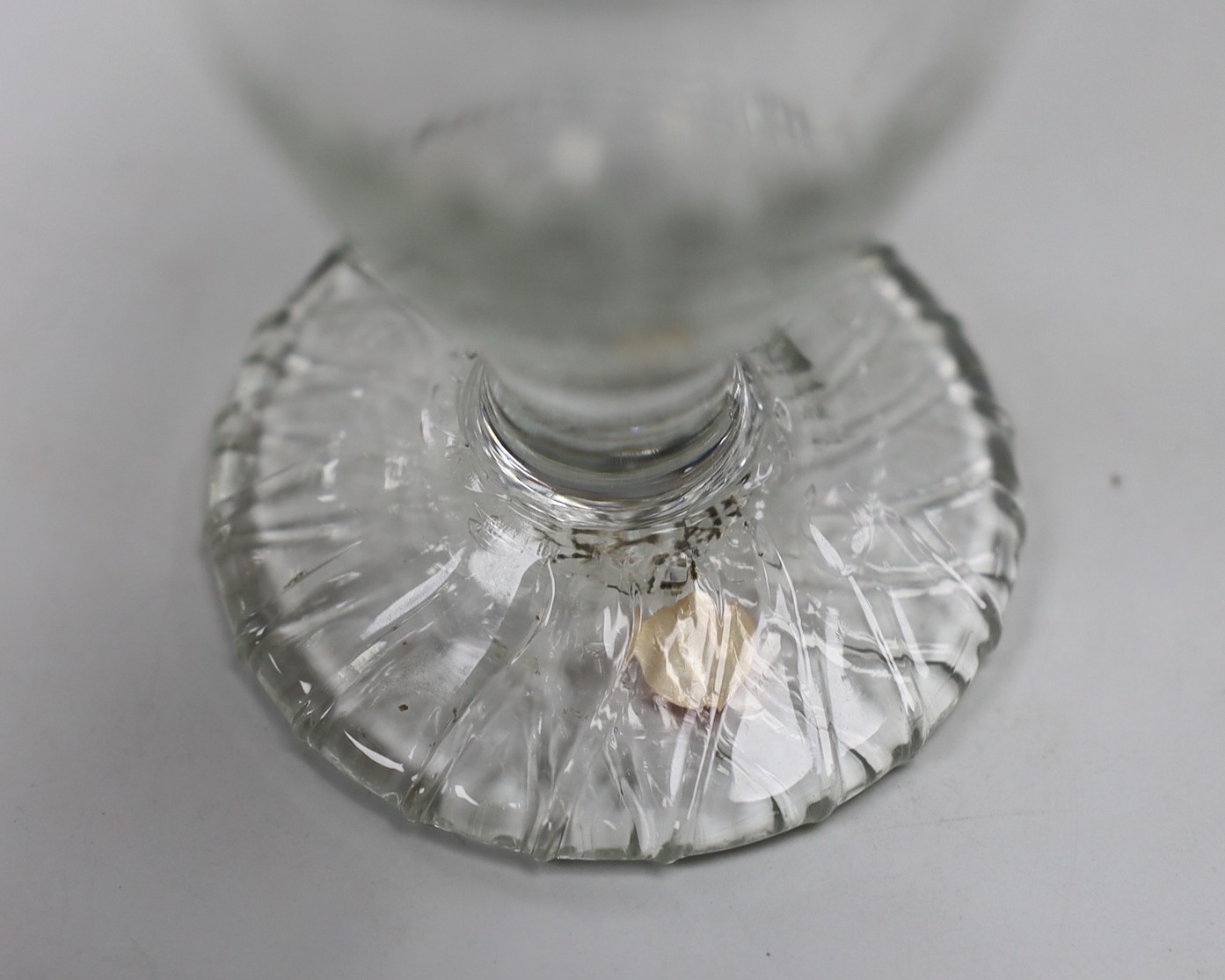 A Georgian moulded toasting glass. 9cm tall
